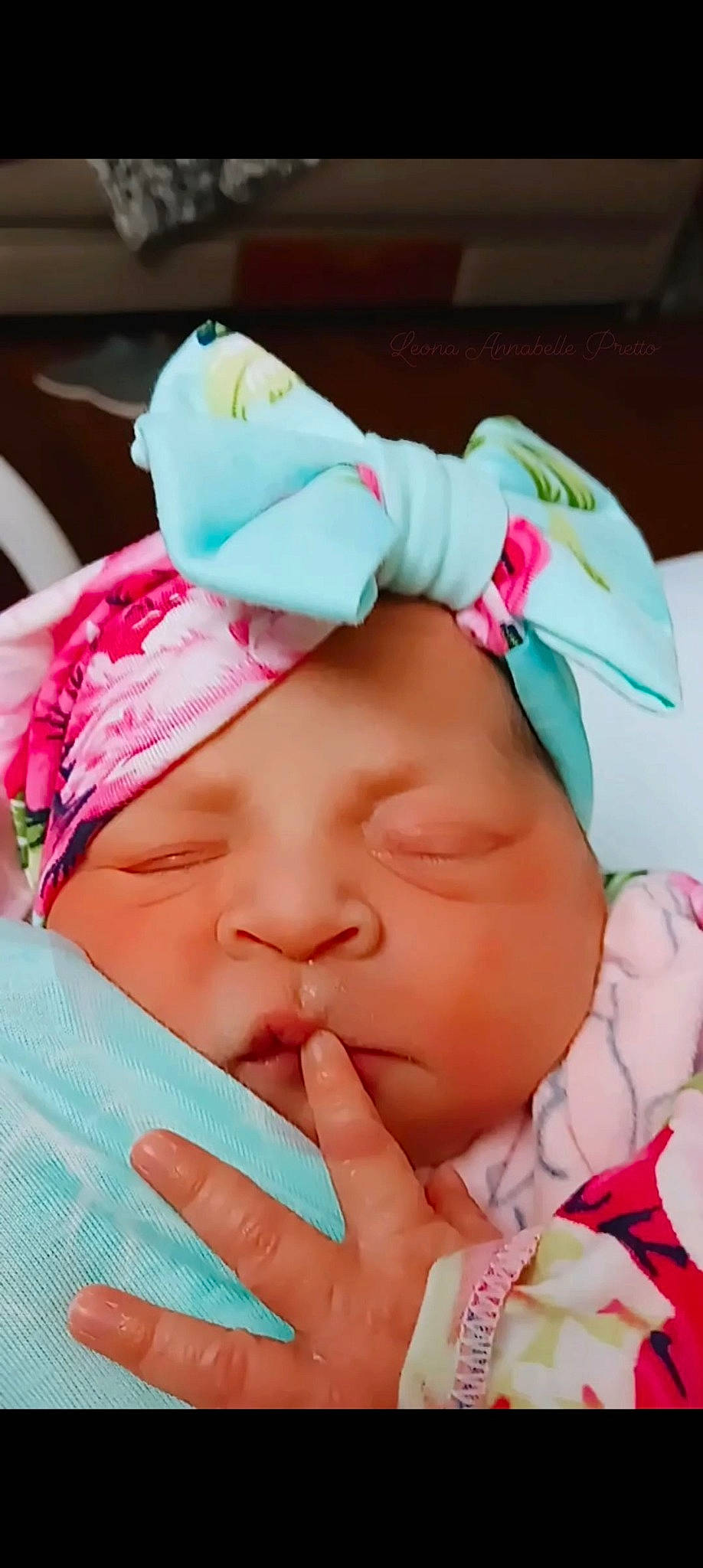 Leona is registered to the contest to win money with this photo: baby, baby_products, baby_toddler_clothing, cheek, child, comfort, eyelash, fashion_accessory, finger, gesture, happy, headgear, headwear, lip, magenta, mouth, nail, person, pink, skin