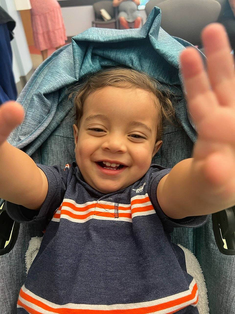 Tobias is registered to the contest to win money with this photo: baby_products, baby_toddler_clothing, cheek, child, eyelash, fashion_accessory, finger, fun, gesture, hand, happy, joy, nose, organ, pattern, person, product, skin, sleeve, smile