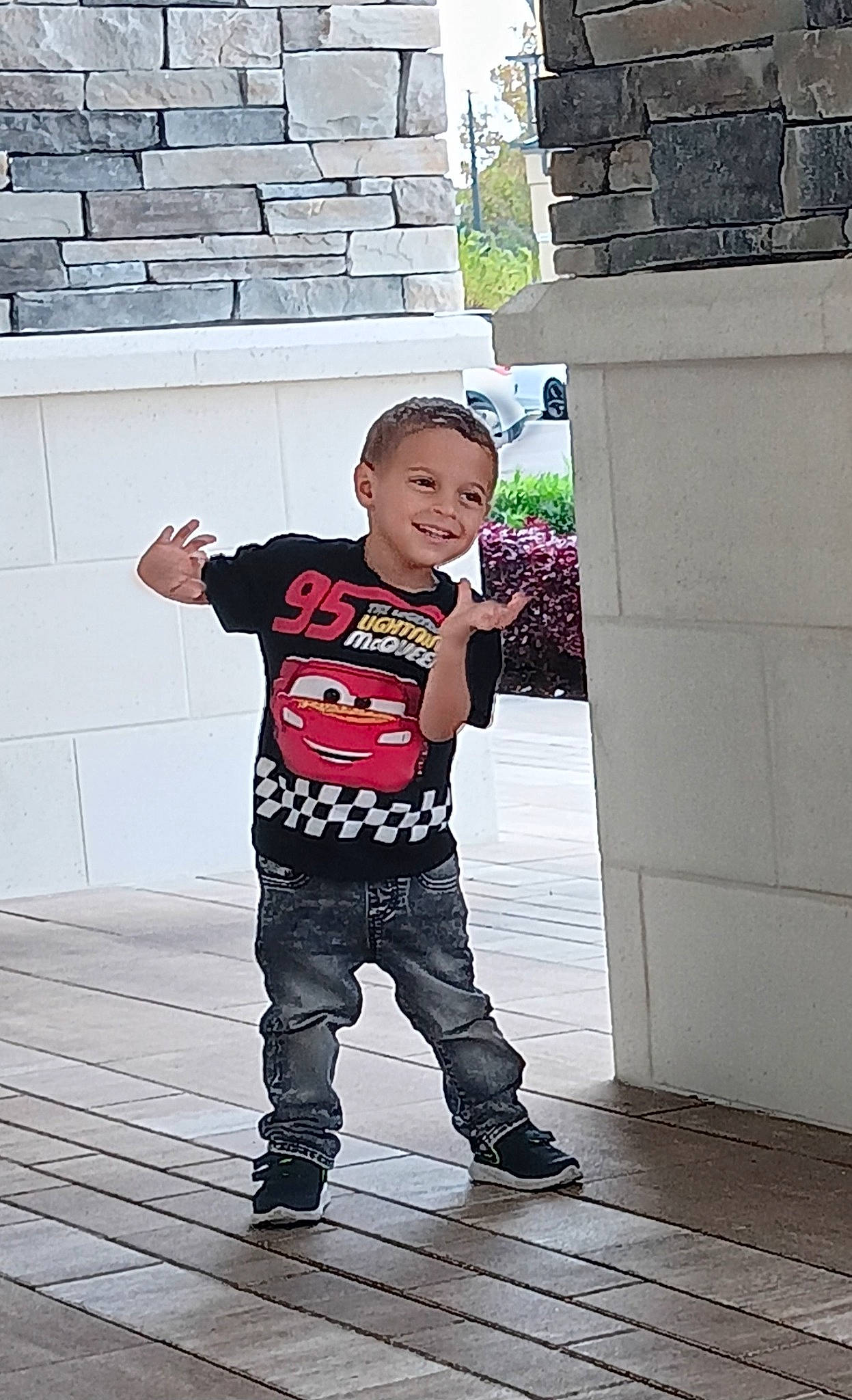 Theodore is registered to the contest to win money with this photo: baby, child, fictional_character, flash_photography, flooring, fun, happy, hat, joy, leisure, outerwear, pattern, person, plant, recreation, sitting, sleeve, standing, t_shirt, toddler