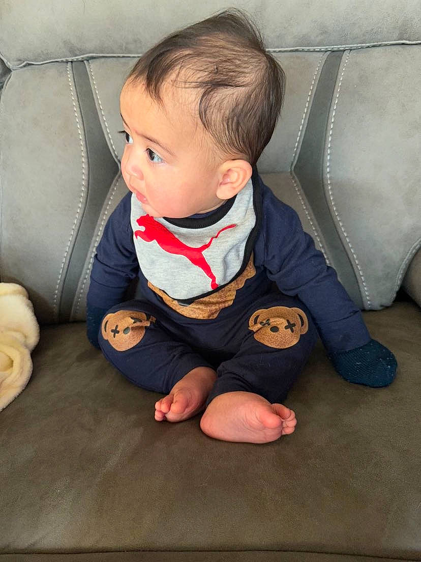 Khaliyah joined the competition — help win amazing prizes! arm, baby, baby_toddler_clothing, cheek, chin, comfort, couch, eye, face, finger, hand, head, human_body, leg, mouth, nose, outerwear, person, skin, sleeve