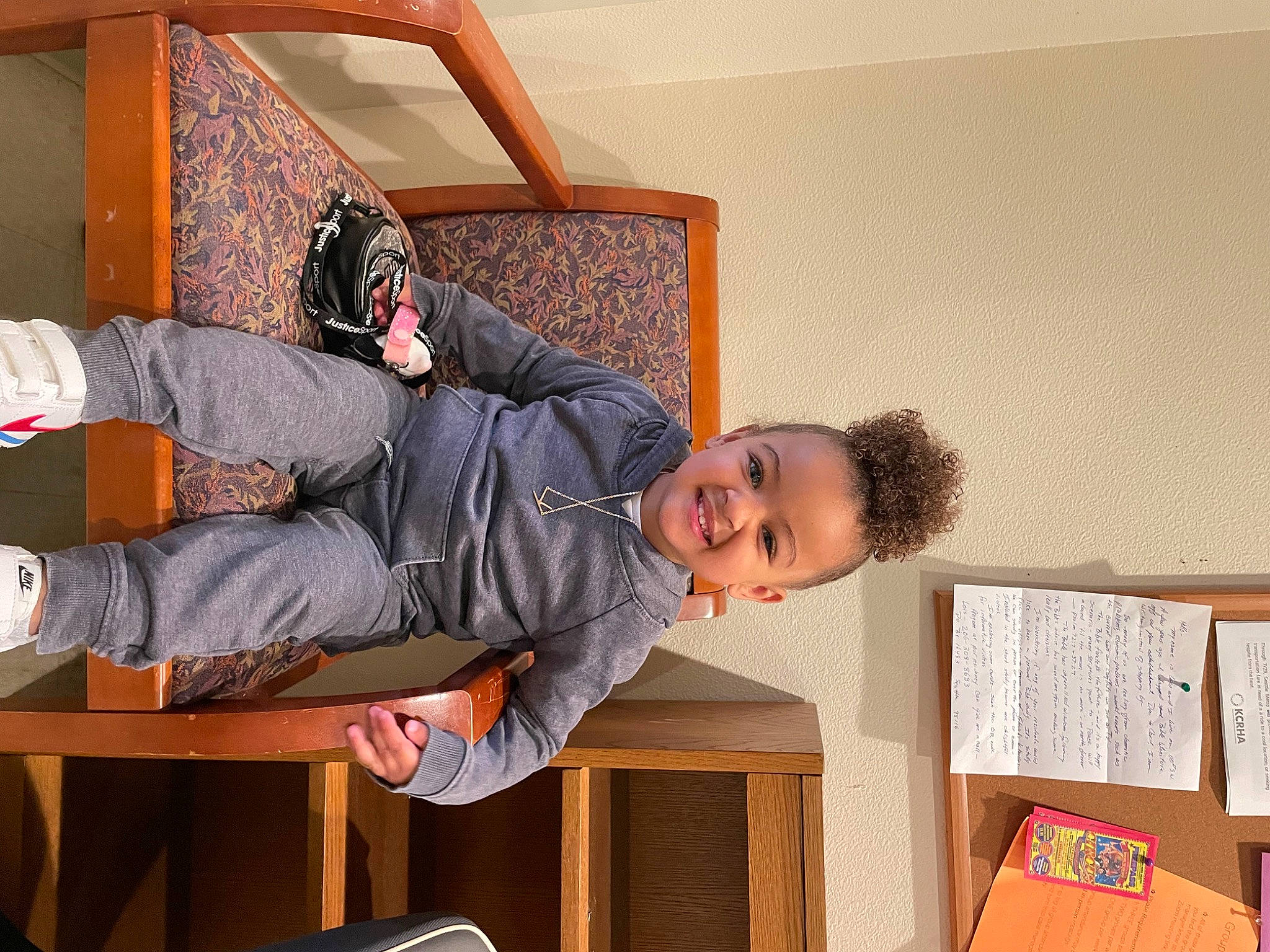 Kruz is registered to the contest to win money with this photo: child, comfort, fun, happy, hardwood, joy, knee, leisure, outdoor_shoe, person, play, room, sitting, smile, sock, toddler, walking_shoe, wood