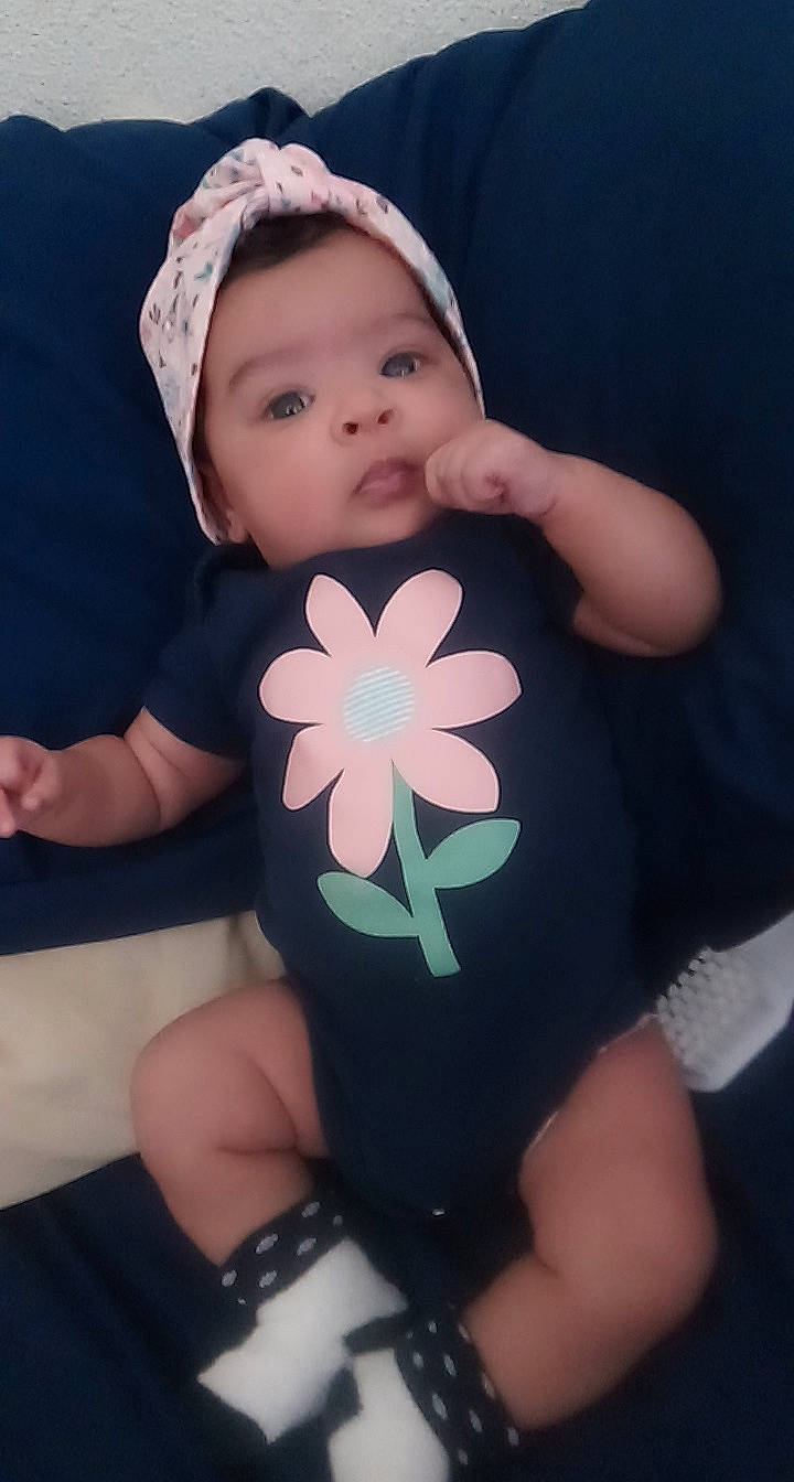 Kruz joined the competition — help win amazing prizes! baby, baby_products, baby_toddler_clothing, cheek, child, flower, hair_accessory, hand, head, headgear, person, pink, plant, skin, toddler