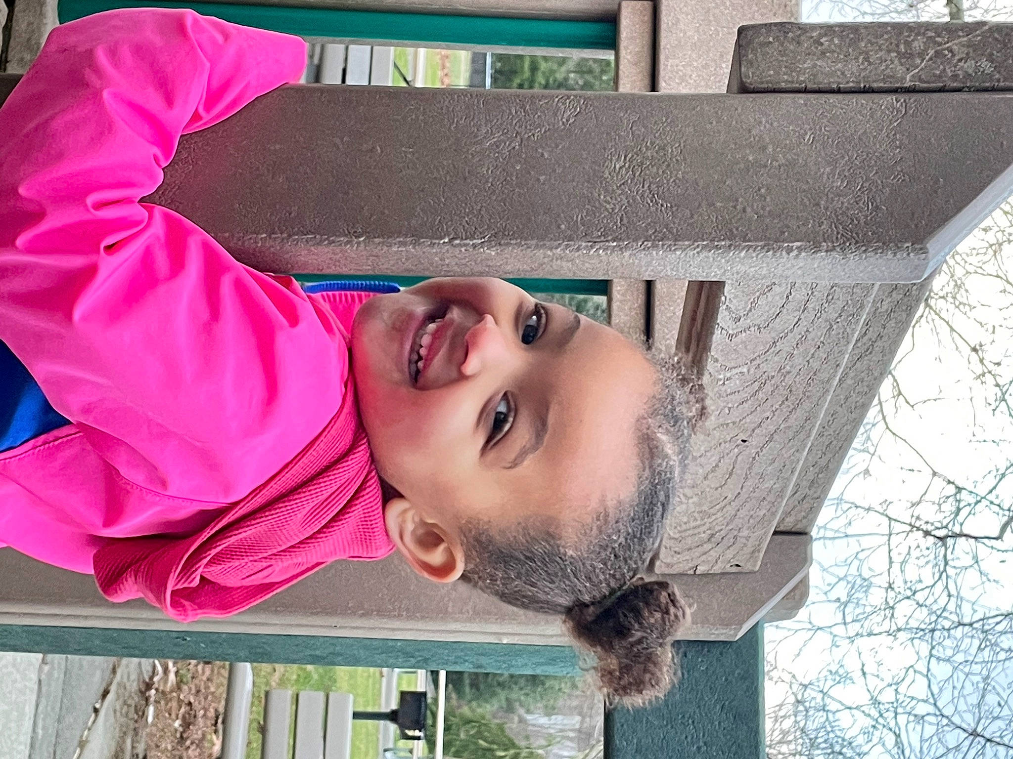 Kruz is registered to the contest to win money with this photo: art, baby_toddler_clothing, child, chin, concrete, fun, happy, joy, leisure, magenta, mouth, nose, pattern, person, public_space, red, sky, smile, toddler, tree