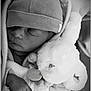 baby, blanket, child, closeup, clothing, cozy, cuddle, cute, hand, hat, infant, monochrome, newborn, peaceful, portrait, rest, sleeping, soft_texture, stuffed_animal, teddy_bear