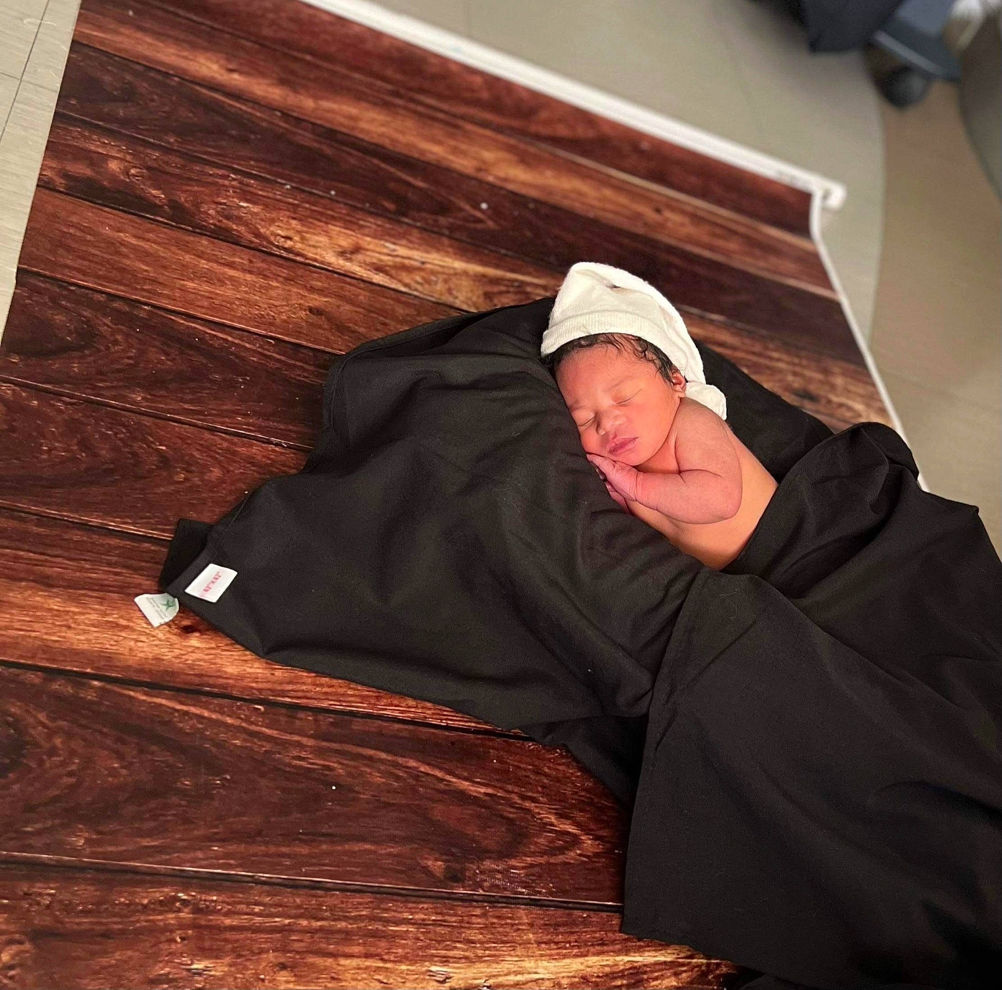 Mason is registered to the contest to win money with this photo: baseball_cap, cap, comfort, flooring, hardwood, headgear, hoodie, landscape, pattern, person, plank, plywood, room, sitting, sleeve, tints_and_shades, varnish, winter, wood, wood_flooring