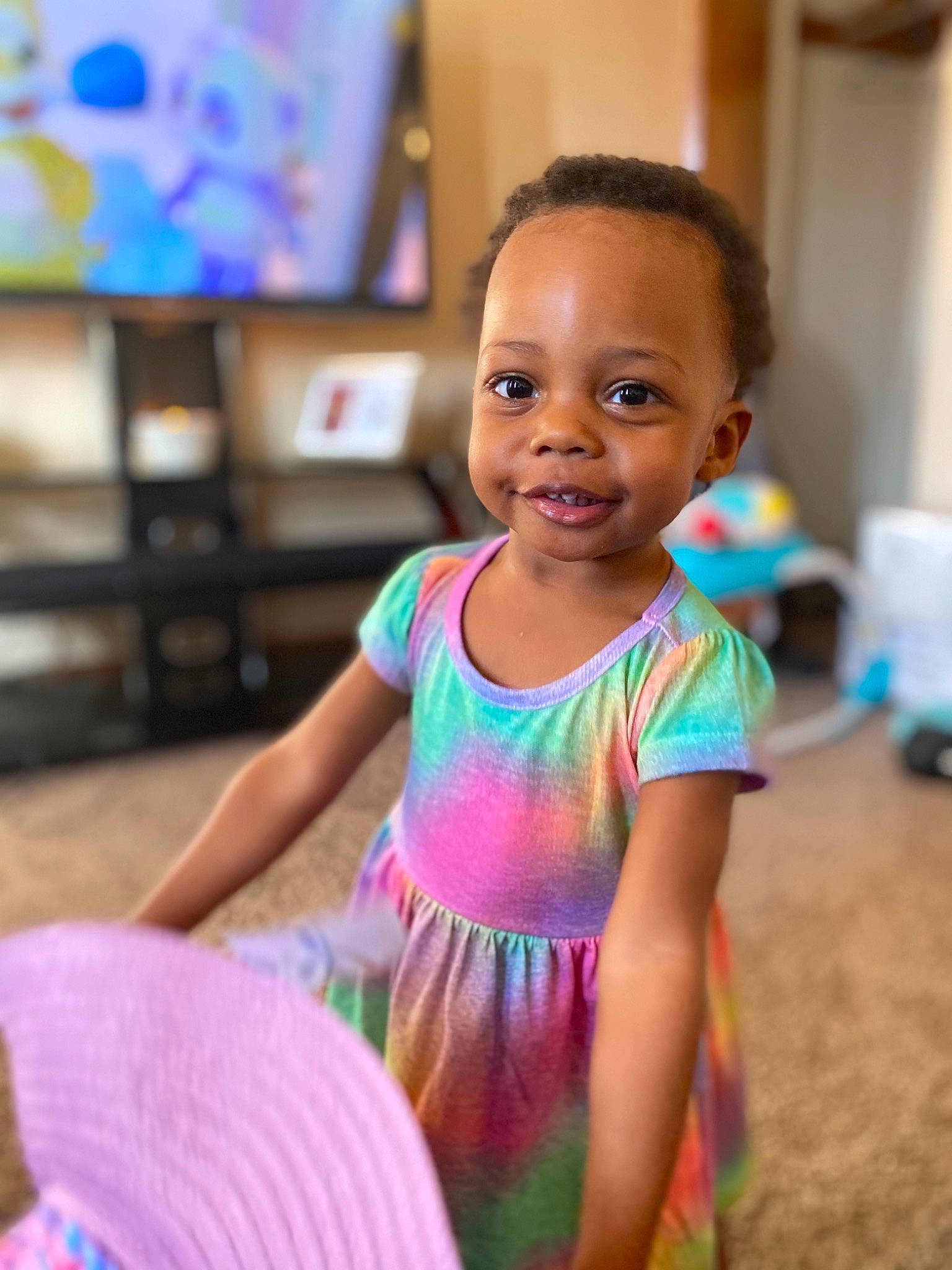 Mila is registered to the contest to win money with this photo: baby_toddler_clothing, beauty, child, dress, electronic_device, face, facial_expression, flash_photography, flooring, fun, hairstyle, happy, iris, joy, leisure, magenta, person, skin, smile, t_shirt