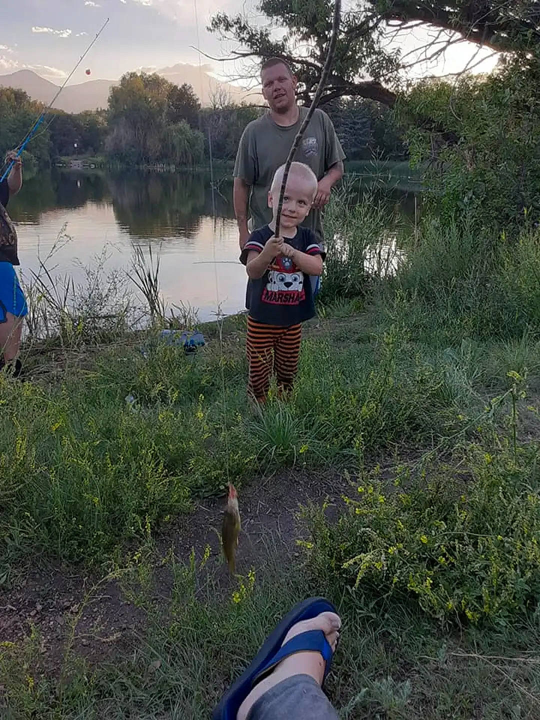 Coal is registered to the contest to win money with this photo: fun, grass, grass_family, grassland, lake, landscape, leisure, luggage_and_bags, people_in_nature, person, plant, recreation, recreational_fishing, sky, soil, spring, summer, tree, vertebrate, water