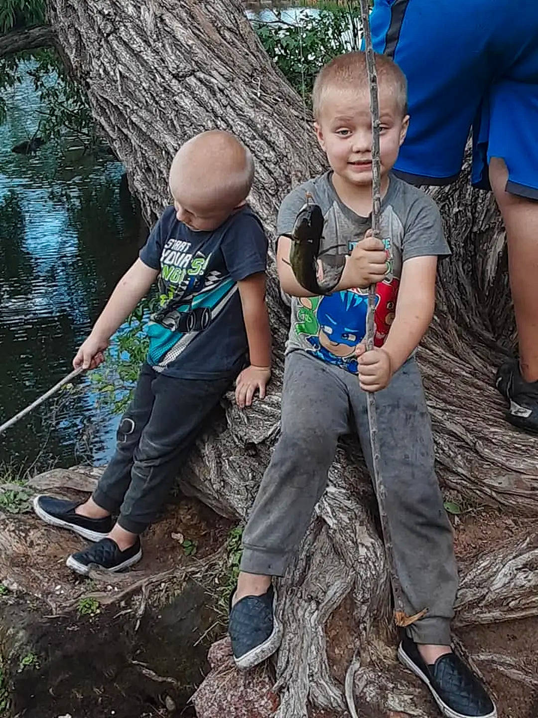 Devon is registered to the contest to win money with this photo: blue, boot, child, climbing, electric_blue, footwear, fun, happy, leg, leisure, people_in_nature, person, recreation, sandal, shoe, shorts, sneakers, sport_climbing, t_shirt, toddler