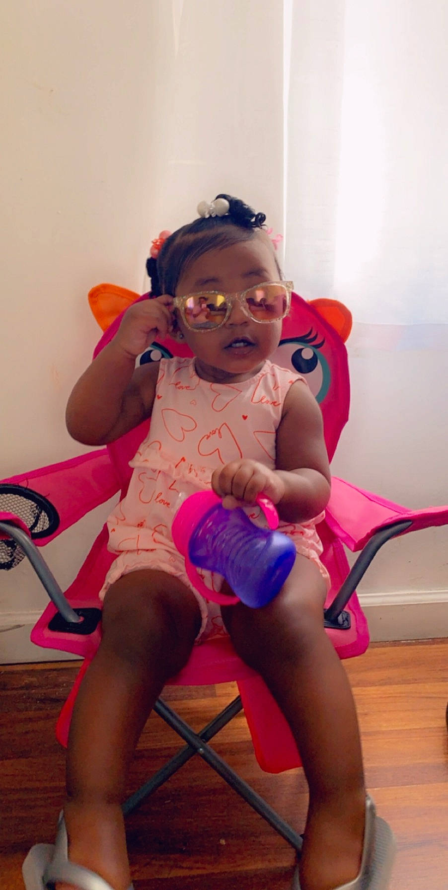 Faithlynn joined the competition — help win amazing prizes! child, fun, glasses, human_leg, joint, knee, leg, person, pigtail, pink, play, sitting, thigh, toddler