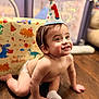 Bishop is registered to the contest to win money with this photo: baby, background, birthday, celebration, child, colorful, crawling, cute, diaper, dinosaur, festive, floor, happy, indoor, one_year_old, party_hat, person, smiling, sock, toy