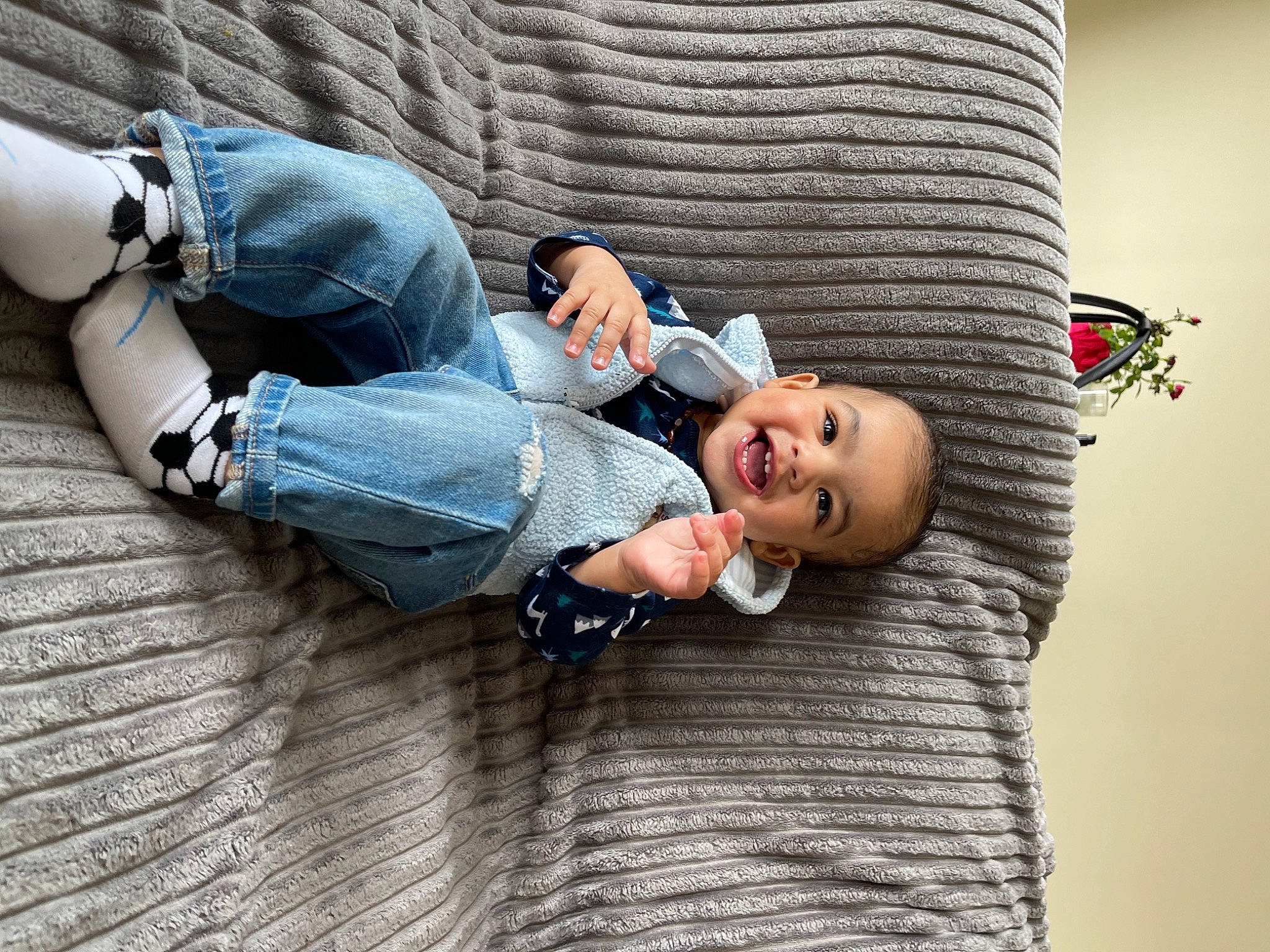 Kairo is registered to the contest to win money with this photo: baby, child, comfort, couch, denim, eyewear, flash_photography, flooring, happy, human_leg, insect, jeans, knee, leisure, person, sitting, t_shirt, thigh, toddler, tree