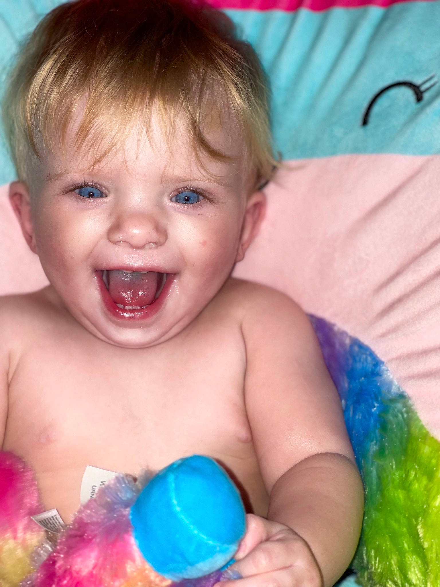 Hadleigh is registered to the contest to win money with this photo: baby, baby_playing_with_toys, blue, cheek, chest, ear, eye, eyelash, facial_expression, finger, fun, happy, human, iris, mouth, nose, person, product, smile, toddler