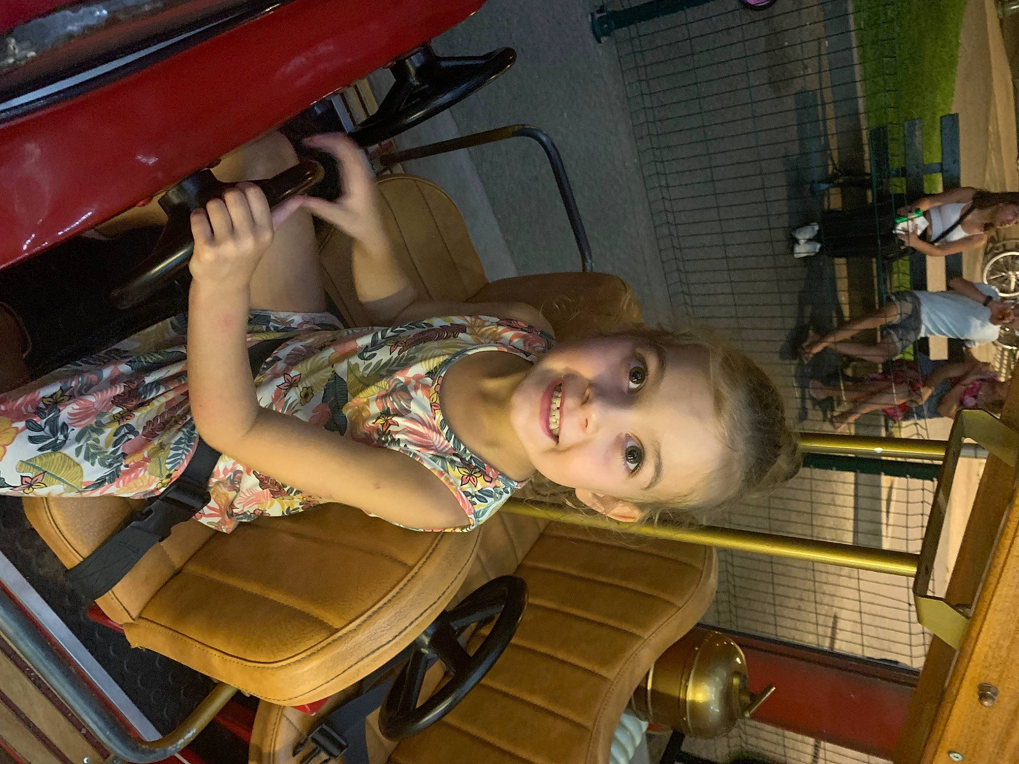 Cassie participe au concours pour gagner de l'argent avec cette photo : auto_part, automotive_design, automotive_exterior, automotive_lighting, bumper, child, family_car, fun, hood, human_leg, joy, leisure, motor_vehicle, person, smile, t_shirt, thigh, tire, toddler, trunk