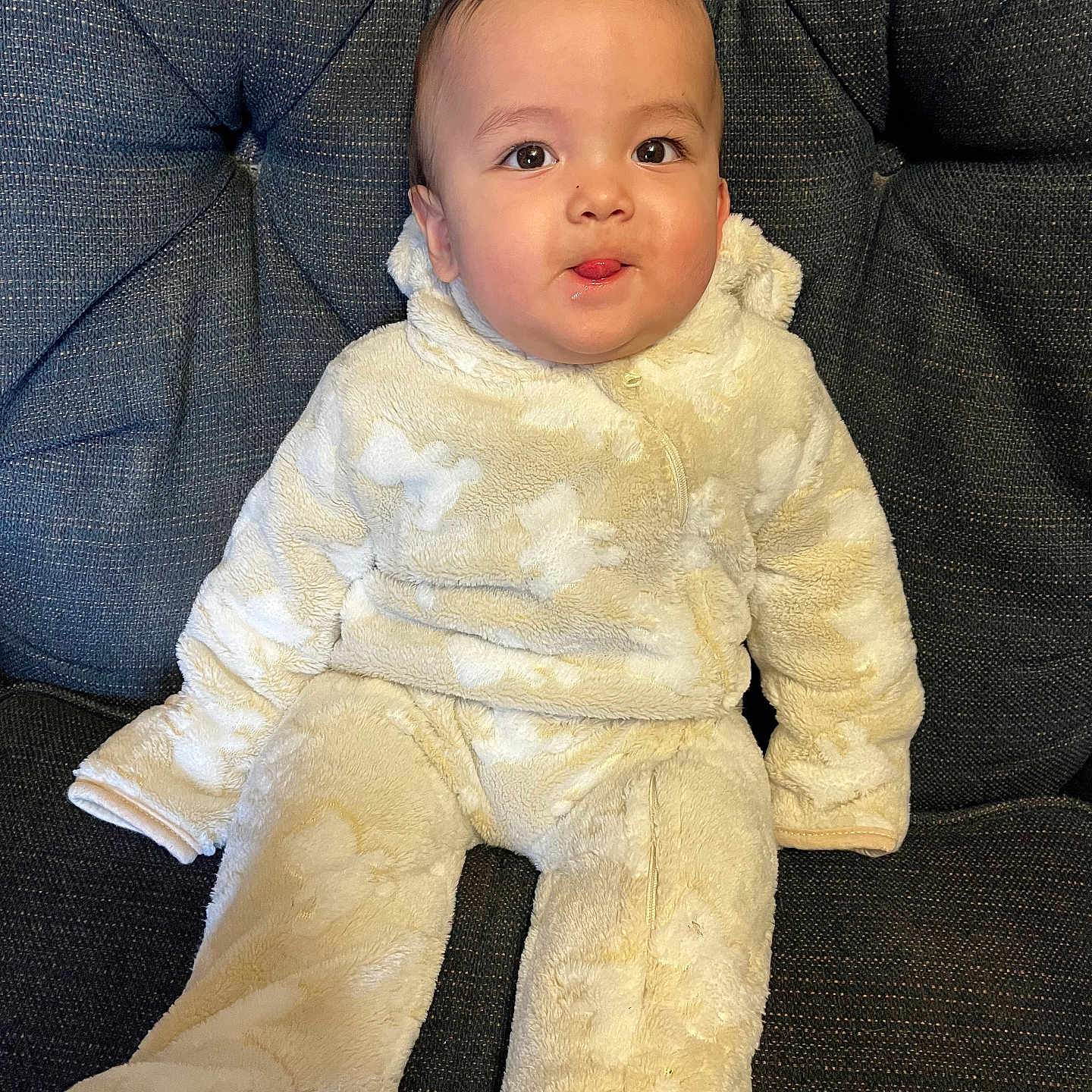 Liam joined the competition — help win amazing prizes! baby, blanket, chair, clothing, coat, couch, cushion, dress, face, furniture, head, homedecor, longsleeve, newborn, pants, person, photography, portrait, sitting, sleeve