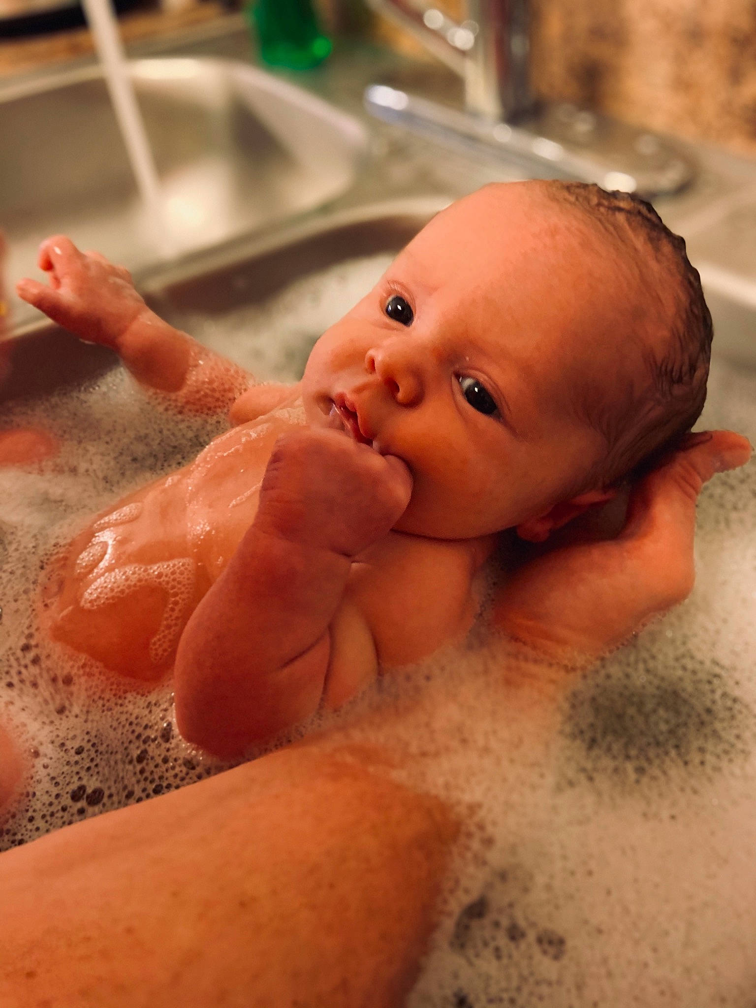 Kade joined the competition — help win amazing prizes! baby, baby_bathing, bathing, cheek, chest, ear, eyelash, finger, fluid, gesture, hand, happy, lip, mouth, nail, neck, nose, person, plumbing_fixture, skin
