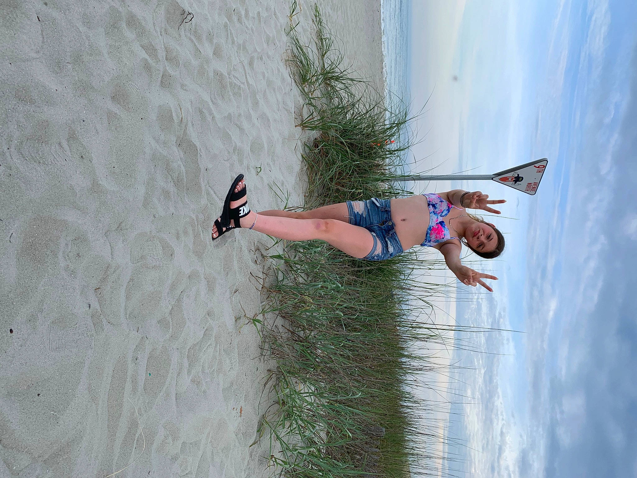 Destiny is registered to the contest to win money with this photo: beach, cloud, electric_blue, extreme_sport, fun, happy, human_leg, knee, landscape, leg, leisure, people_in_nature, person, plant, recreation, shadow, sky, street_fashion, thigh, tree