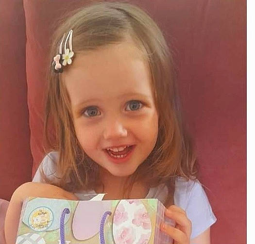 Kaitlyn is registered to the contest to win money with this photo: baby_toddler_clothing, beauty, blond, cheek, child, eyelash, face, facial_expression, fashion_accessory, fun, happy, headband, headpiece, iris, jewellery, pattern, person, pink, skin, smile