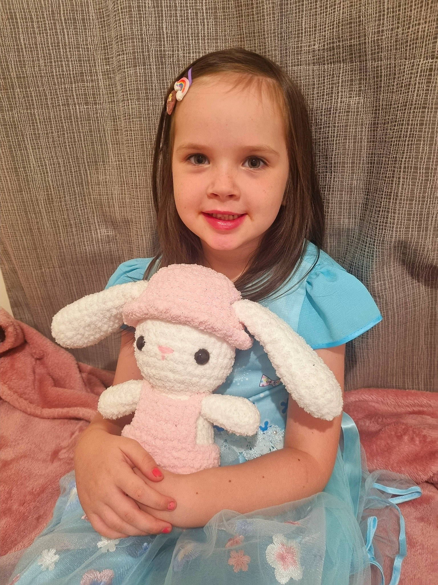 Grace-lyn is registered to the contest to win money with this photo: arm, baby_toddler_clothing, cheek, ear, eyelash, fawn, hair, happy, head, human_body, joy, neck, nose, person, pink, rabbit, skin, sleeve, smile, textile