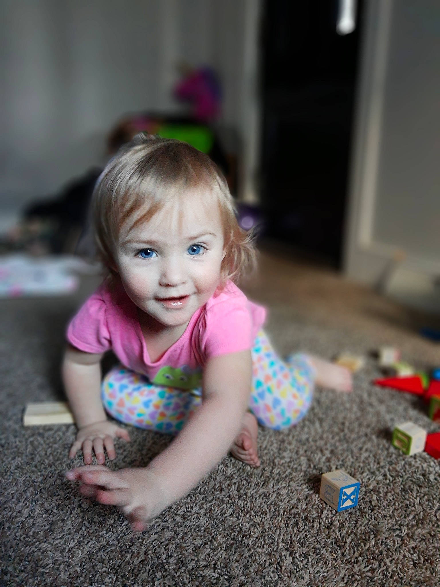 Joy joined the competition — help win amazing prizes! baby, beauty, cheek, child, dress, eye, face, floor, flooring, fun, head, iris, people, person, photography, pink, play, sitting, skin, smile