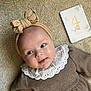 Victoria participe au concours pour gagner de l'argent avec cette photo : 4_months, baby, blue_eyes, bow, brown_dress, carpet, child, closeup, cute, headband, indoors, infant, lace_collar, lying_down, milestone_card, newborn, person, portrait, smiling, soft_lighting