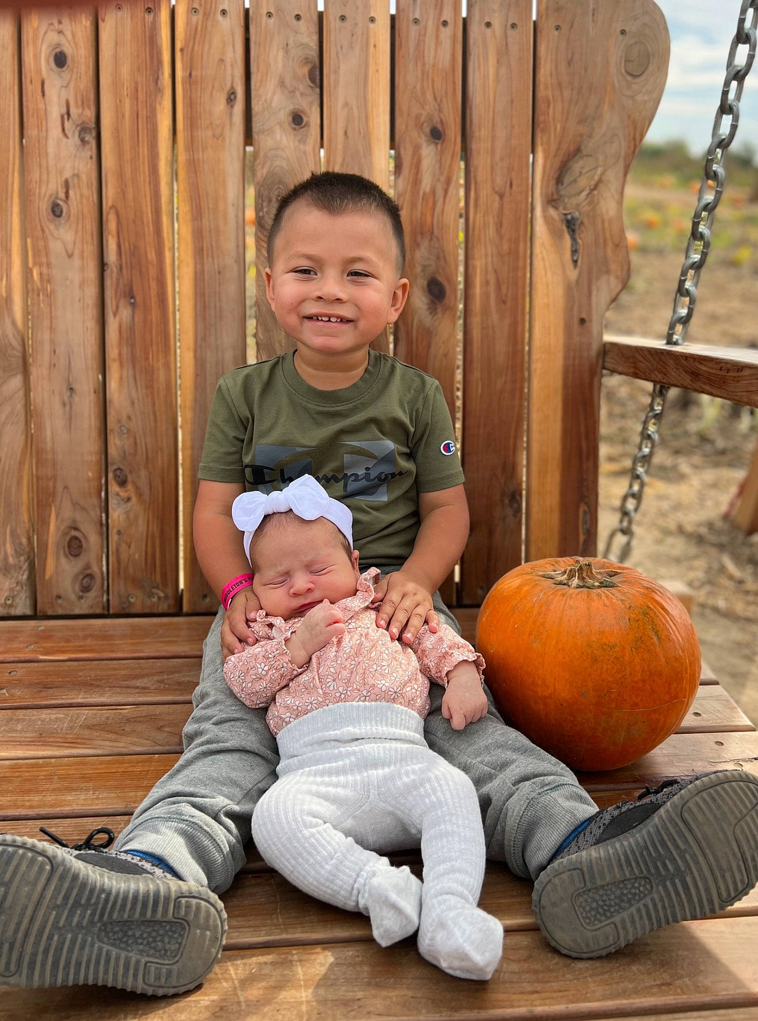 Bentley joined the competition — help win amazing prizes! baby_toddler_clothing, calabaza, child, clothing, comfort, cucurbita, facial_expression, fun, gourd, grass, happy, joy, leg, leisure, people, person, pumpkin, smile, standing, toddler