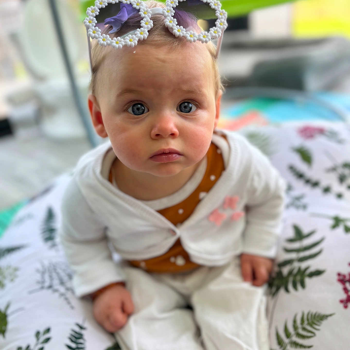 Camélia participe au concours pour gagner de l'argent avec cette photo : accessories, baby, bodypart, clothing, couch, cushion, dress, face, finger, furniture, hand, hat, head, homedecor, jewelry, newborn, person, photography, portrait, sitting