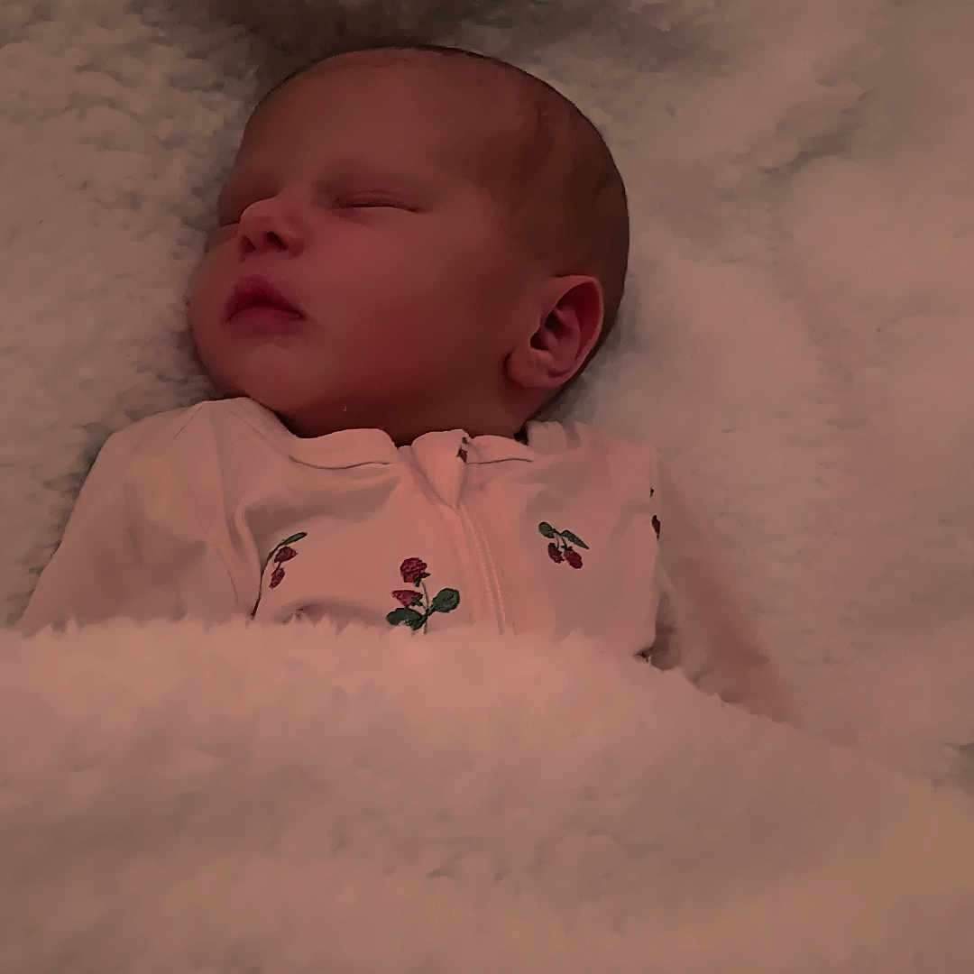 Isela joined the competition — help win amazing prizes! baby, blanket, child, comfort, cozy, cute, face, head, indoors, infant, newborn, pajamas, peaceful, person, rest, sleep, sleeping, soft, toddler, warm