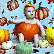 Leighton is registered to the contest to win money with this photo: baby, pumpkin, costume, fall, autumn, orange, yellow, green, white, child, cute, festive, background, leaves, smiling, sitting, holiday, celebration, headwear, seasonal