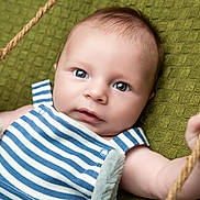 Leighton is registered to the contest to win money with this photo: baby, infant, child, blue_striped_clothing, rope, green_blanket, close_up, portrait, cute, grip, hand, face, skin, eyes, expression, soft_texture, lying_down, young, adorable, baby_clothes