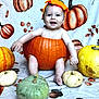 Leighton is registered to the contest to win money with this photo: baby, pumpkin, costume, fall, autumn, smiling, child, orange, green, yellow, white, blanket, cute, festive, holiday, sitting, headwear, happy, decor, seasonal