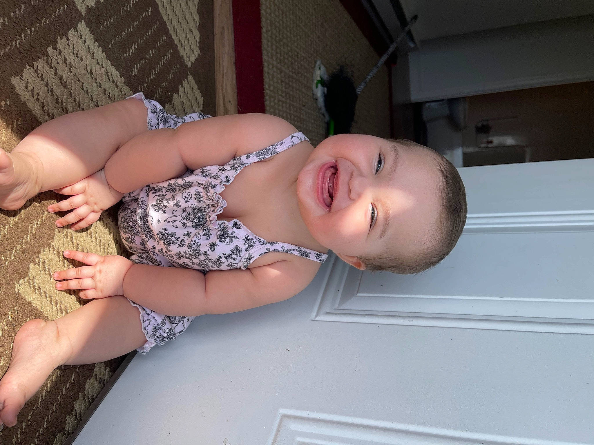 Kali is registered to the contest to win money with this photo: abdomen, baby, baby_toddler_clothing, chest, child, eyelash, finger, foot, fun, happy, human_body, human_leg, joy, pattern, person, room, skin, smile, thigh, toddler