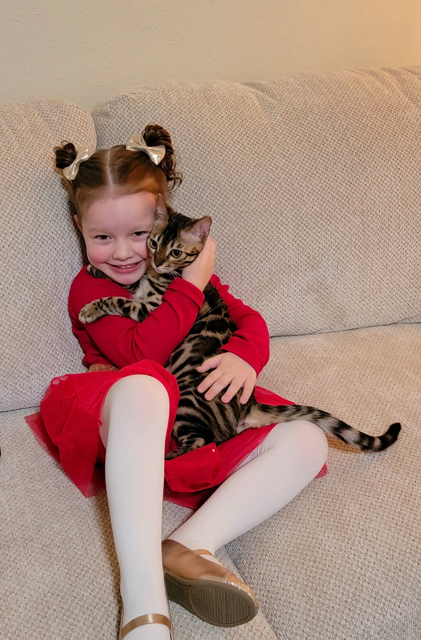 Reggie joined the competition — help win amazing prizes! baby_toddler_clothing, boot, brown_hair, carmine, comfort, eyewear, fashion_design, fun, happy, human_leg, knee, lap, leg, pattern, sitting, sleeve, smile, sock, sportswear, thigh