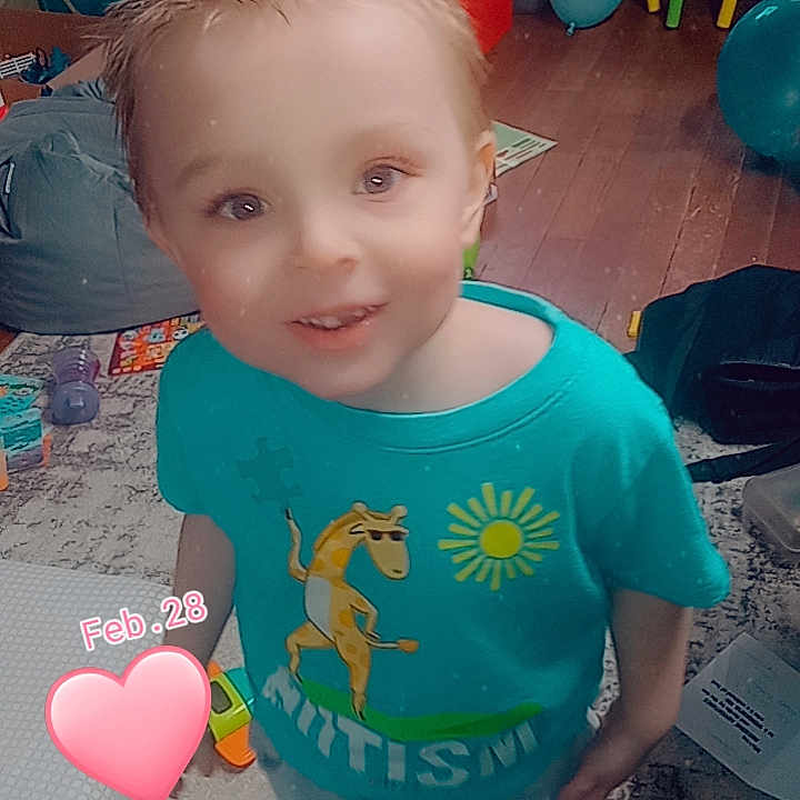 Jameson is registered to the contest to win money with this photo: applique, architecture, baby, balloon, bodypart, clothing, face, finger, footwear, hand, head, indoors, inflatable, pattern, person, photography, portrait, shoe, sphere, t_shirt