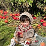 toddler, child, apple, knitted_hat, knitted_sweater, grass, autumn, outdoor, fruit, red_apple, bag, socks, cute, smiling, nature, leaf, sunlight, garden, happy, sitting