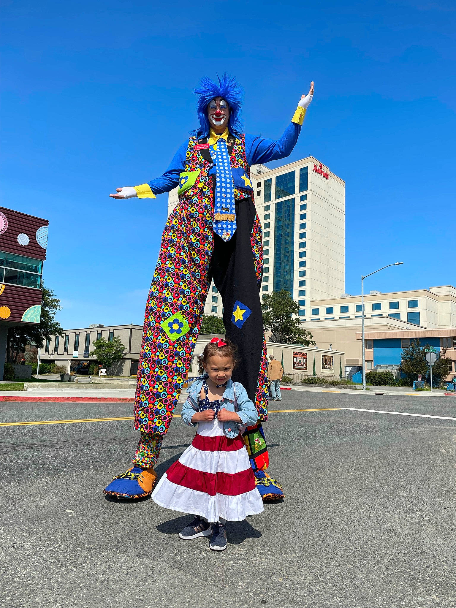 Gracelynne joined the competition — help win amazing prizes! art, asphalt, building, city, costume, entertainment, event, fun, joy, landmark, leisure, pedestrian, performing_arts, person, pole, recreation, road, sculpture, sky, travel