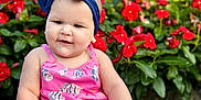 Eloah joined the competition — help win amazing prizes! baby, blanket, bow, child, cute, flowers, footwear, grass, greenery, happy, headband, nature, outdoor, pink_clothing, portrait, red_flowers, sitting, smiling, summer, sunlight
