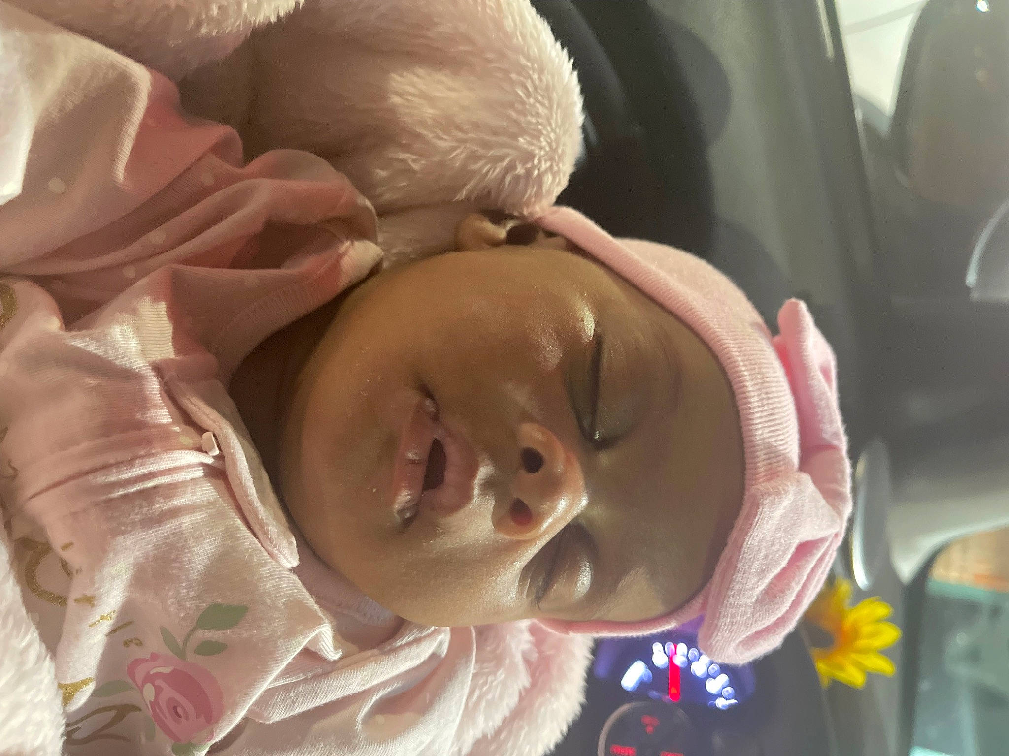 Reign is registered to the contest to win money with this photo: baby, baby_products, bedtime, car_seat, cheek, child, comfort, ear, eyebrow, happy, headgear, laugh, linens, mouth, nose, person, smile, toddler, tree, vehicle_door