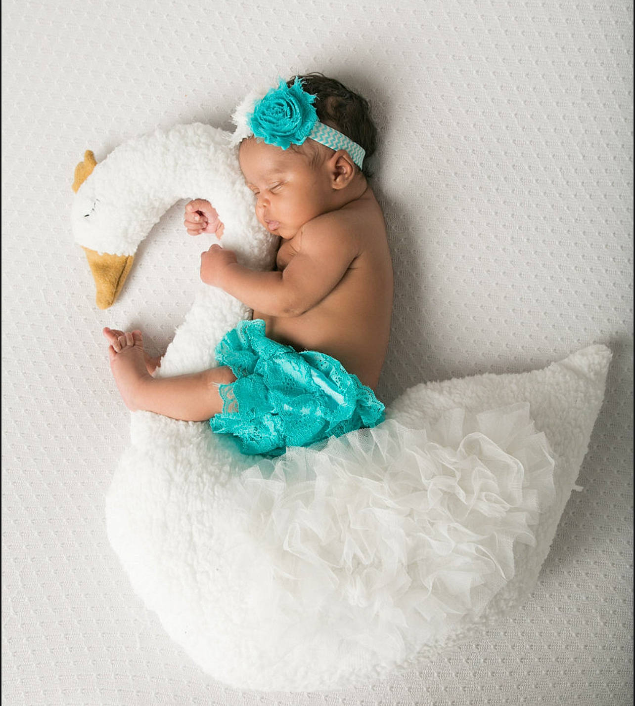 Reign is registered to the contest to win money with this photo: baby, baby_products, baby_toddler_clothing, cap, child, comfort, costume, event, fashion_accessory, flash_photography, fun, hair_accessory, happy, headband, headpiece, headwear, jewellery, linens, person, sitting