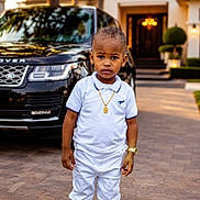 Gracious joined the competition — help win amazing prizes! casual, child, driveway, fashion, gold_chain, gold_watch, house, luxury_car, outdoor, pavement, person, portrait, range_rover, serious_expression, sneakers, standing, sunset_light, toddler, urban, white_clothing