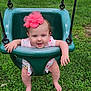 Amara is registered to the contest to win money with this photo: baby, child, swing, playground, grass, outdoor, flower_headband, pink, green, happy, smiling, infant, summer, fun, legs, barefoot, cute, person, toddler, clothing