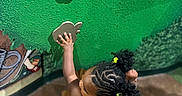 Zailah is registered to the contest to win money with this photo: animal, aquarium, blackhair, braid, child, clothing, cornrows, curlyhair, face, female, fish, footwear, girl, hair, head, person, sealife, shoe, sleeve, water