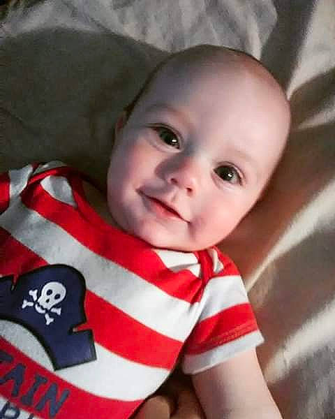 Elija is registered to the contest to win money with this photo: boy, cheek, child, cool, eye, face, forehead, head, infant, lip, mouth, nose, person, product, red, skin, smile, toddler