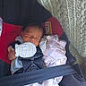 Nehemiah joined the competition — help win amazing prizes! baby, newborn, car_seat, mittens, blanket, infant, sleeping, child, straps, clothing, soft, cozy, cute, person, indoors, fabric, knitted_blanket, rest, safety, peaceful
