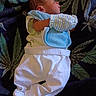 Nehemiah joined the competition — help win amazing prizes! newborn, baby, sleeping, infant, blanket, leaf_pattern, clothing, white_pants, mitten, side_profile, peaceful, resting, soft_fabric, indoors, cute, small, child, portrait, lying_down, cozy