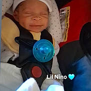 Nehemiah joined the competition — help win amazing prizes! baby, infant, car_seat, pacifier, hat, smiling, child, seatbelt, clothing, blanket, indoor, cute, newborn, face, sleeping, safety, baby_gear, text_overlay, blue, adorable