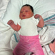 Nayali joined the competition — help win amazing prizes! newborn, baby, infant, pink_pants, white_shirt, hospital_wristband, blanket, lying_down, indoors, face, person, skin, clothing, sleepy, cute, small_hands, hospital, soft_texture, resting, portrait