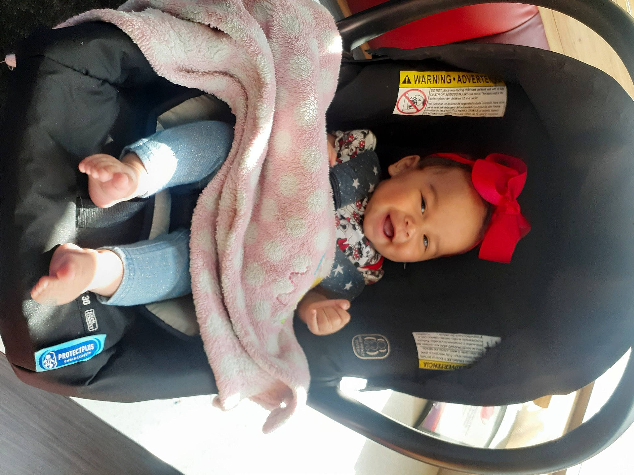Taniya is registered to the contest to win money with this photo: arm, auto_part, baby, baby_carriage, baby_in_car_seat, baby_products, baby_toddler_clothing, car_seat, child, comfort, fashion_accessory, finger, fun, lap, mammal, mouth, nail, person, sitting, toddler