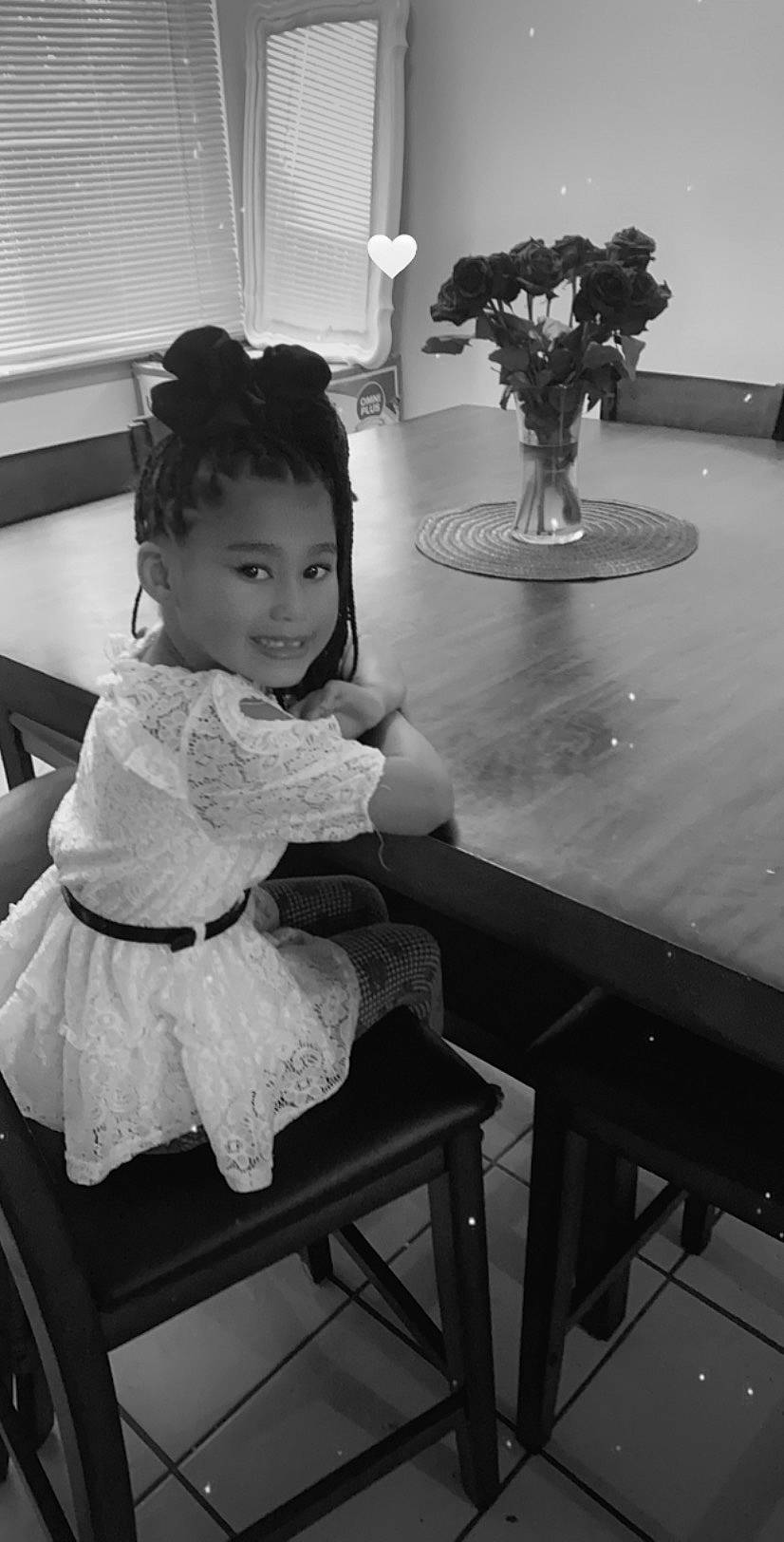 Unique is registered to the contest to win money with this photo: black, black_and_white, child, dress, eye, furniture, hand, joy, leg, monochrome, monochrome_photography, person, photograph, photography, room, sitting, snapshot, standing, stock_photography, table