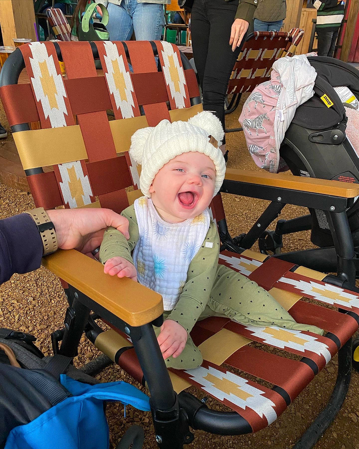 Hallie is registered to the contest to win money with this photo: baby, baby_products, baby_toddler_clothing, baseball_cap, cap, chair, child, event, fashion_accessory, fun, happy, hat, headwear, lap, leisure, person, recreation, sitting, smile, sun_hat