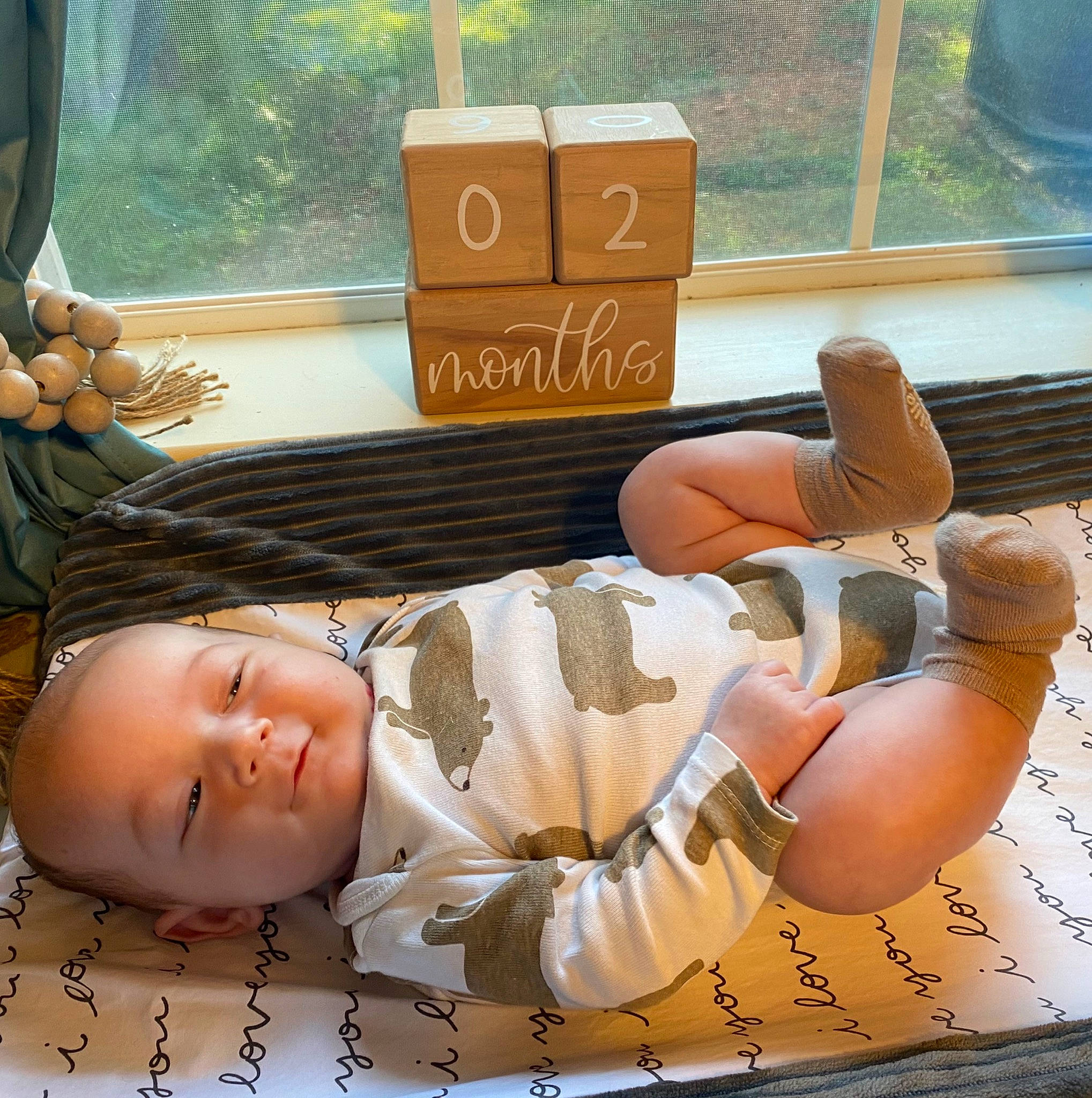 Liam joined the competition — help win amazing prizes! baby, baby_toddler_clothing, box, brown, carton, child, comfort, curtain, flesh, flooring, happy, human_leg, pattern, person, room, shipping_box, thigh, thumb, toddler, window